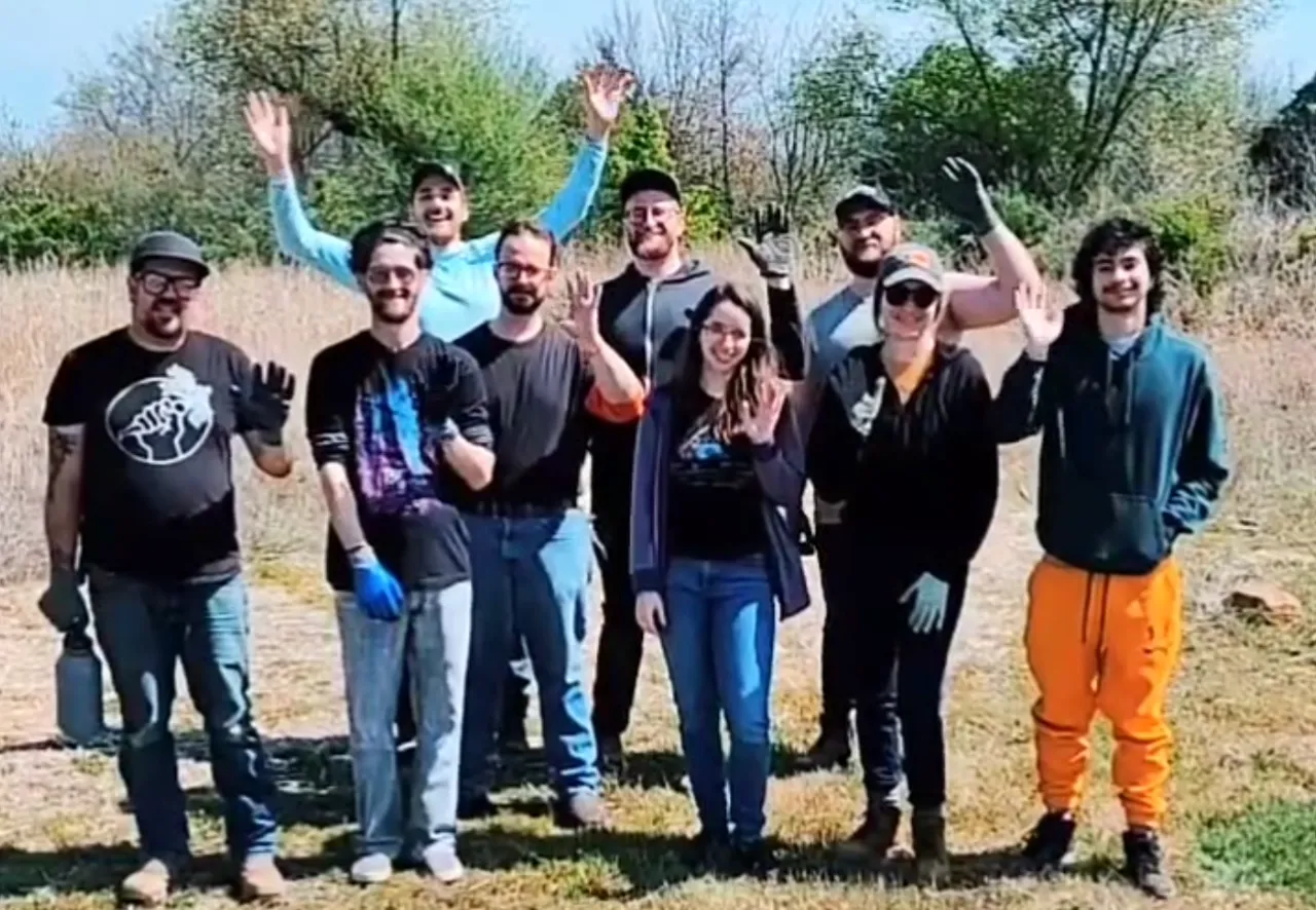 Cooperation Tulsa volunteers waving at the camera