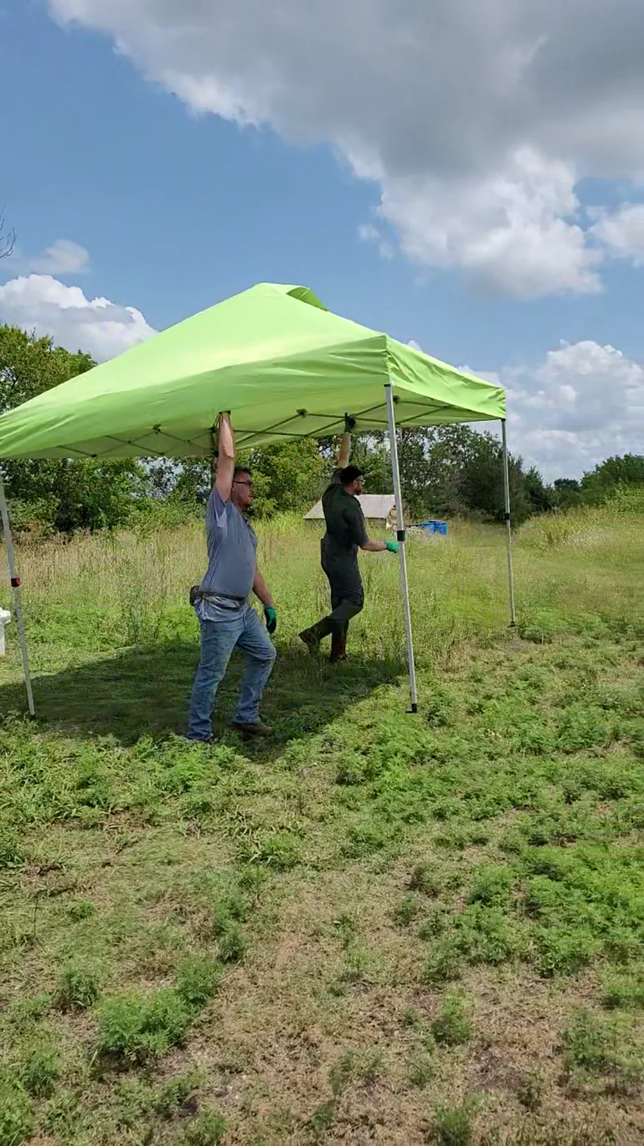 Volunteers setting up a canopy at Flat Rock garden